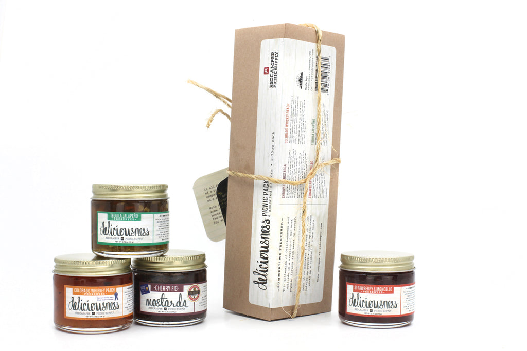 Small Jars of Deliciousness Jam 4 pack stacked in box with twine Colorado Whiskey Peach, Tequila Jalapeño, Cherry Fig Mostarda