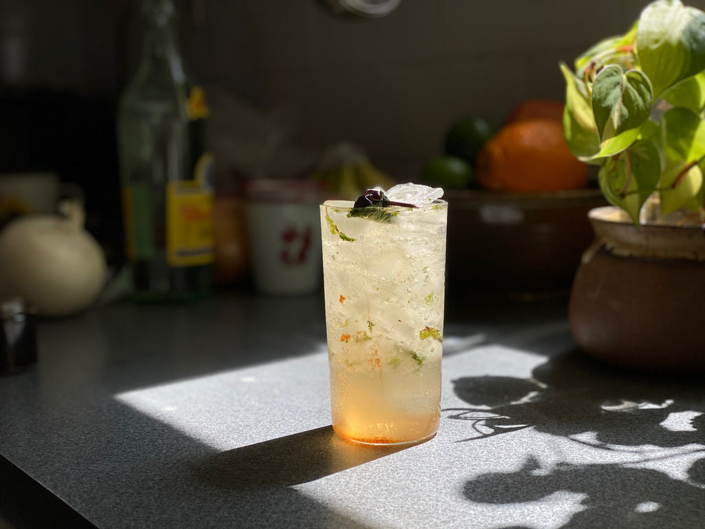 our SUMMERTIME IN THE PINES COCKTAIL garnished with RedCamper Bourbon Cocktail Cherries 